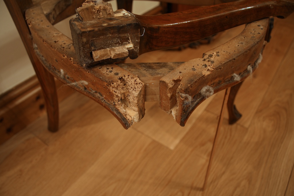 The restoration of a carved walnut with severe woodworm damage
